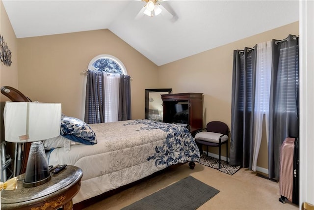 bedroom with lofted ceiling, ceiling fan, and light colored carpet