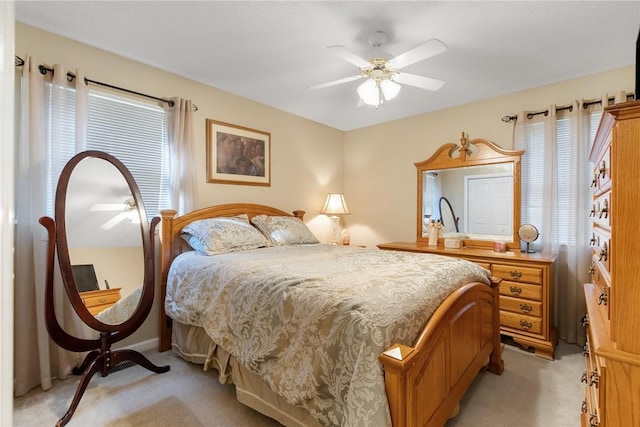 bedroom featuring ceiling fan and light colored carpet