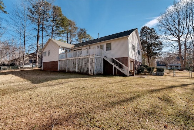 rear view of property with a lawn