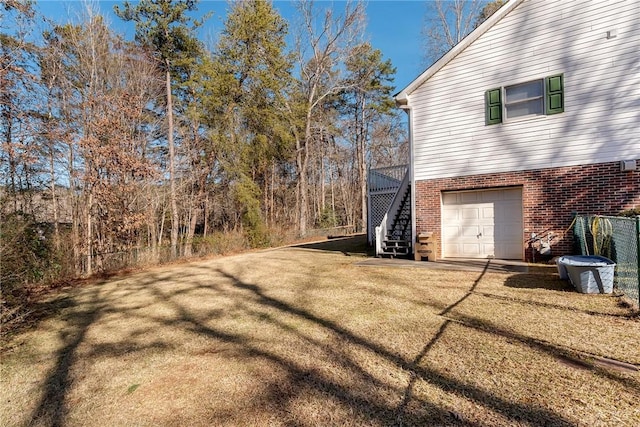 view of yard with a garage