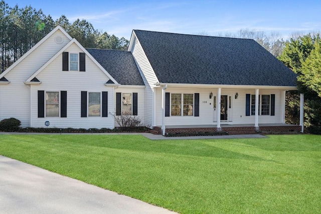 view of front of property with a porch, a shingled roof, and a front lawn