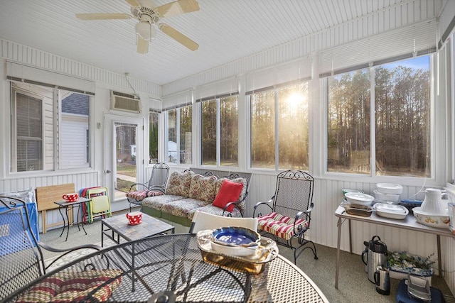 sunroom with plenty of natural light, ceiling fan, and a wall mounted AC