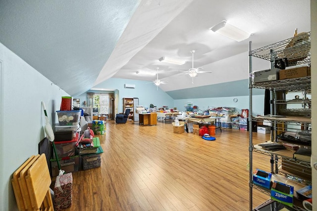 interior space featuring lofted ceiling, ceiling fan, and wood finished floors