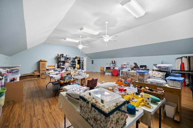 playroom with lofted ceiling, ceiling fan, and wood finished floors