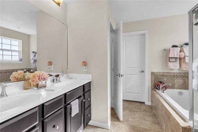 bathroom with a relaxing tiled tub and vanity