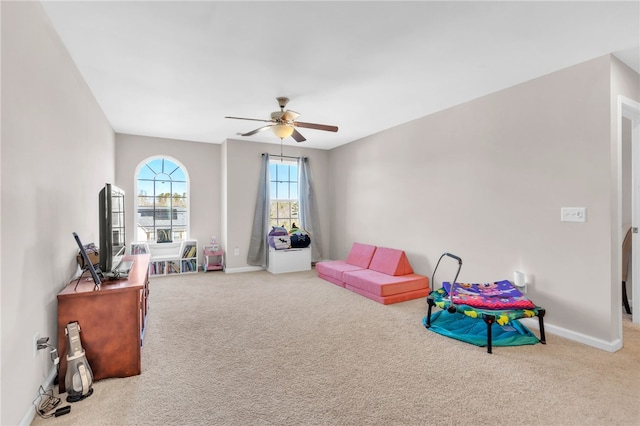 playroom with carpet flooring and ceiling fan