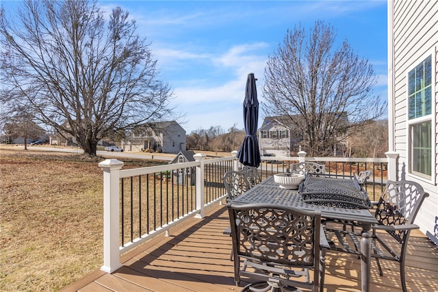 wooden deck featuring a yard