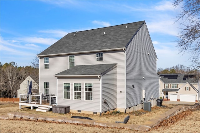 back of house featuring a deck and central AC unit