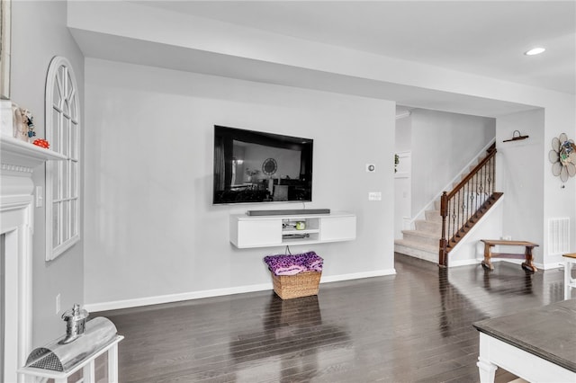 living room with dark hardwood / wood-style floors