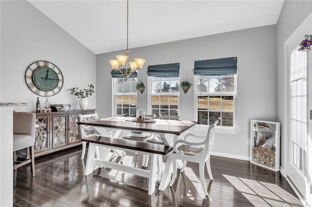 dining area with a notable chandelier, plenty of natural light, and dark hardwood / wood-style floors