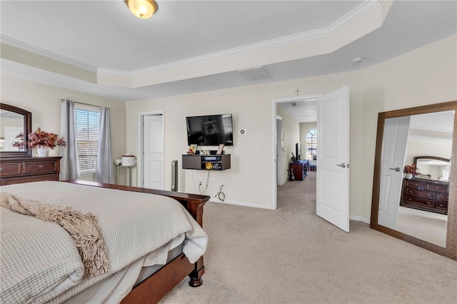 bedroom featuring a raised ceiling, light colored carpet, and ornamental molding