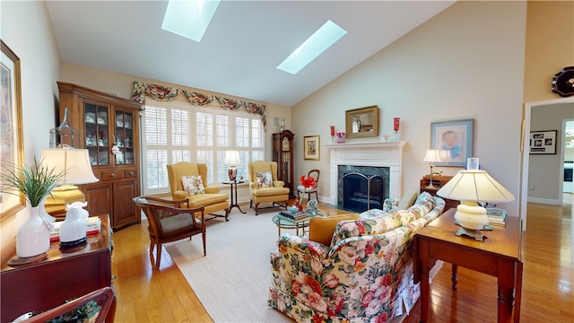 living room with vaulted ceiling, a fireplace, and wood-type flooring