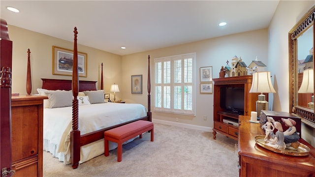 bedroom featuring light carpet