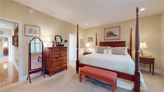 bedroom with light colored carpet and a closet