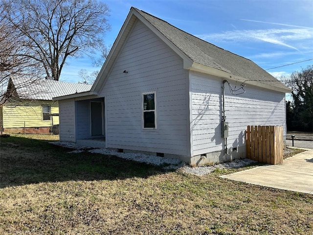 back of property featuring a lawn