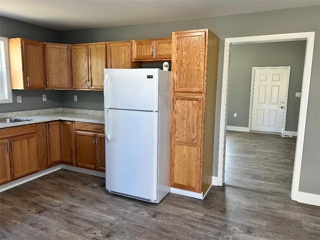 kitchen featuring dark wood-type flooring and white refrigerator