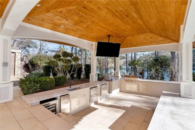 view of patio / terrace with sink, a grill, and area for grilling