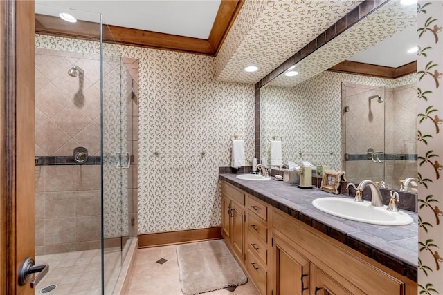 bathroom with tile patterned floors, walk in shower, and vanity