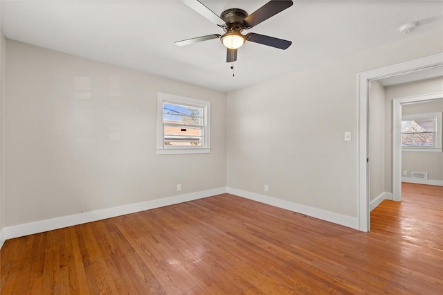 spare room featuring ceiling fan and light hardwood / wood-style flooring