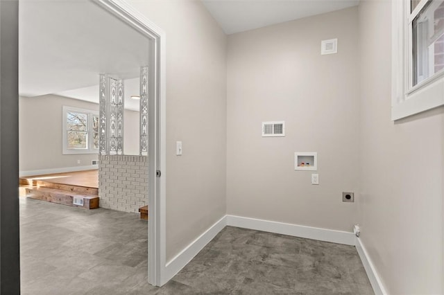 clothes washing area with washer hookup and hookup for an electric dryer