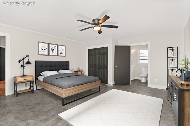 bedroom with ceiling fan, ensuite bathroom, and a closet