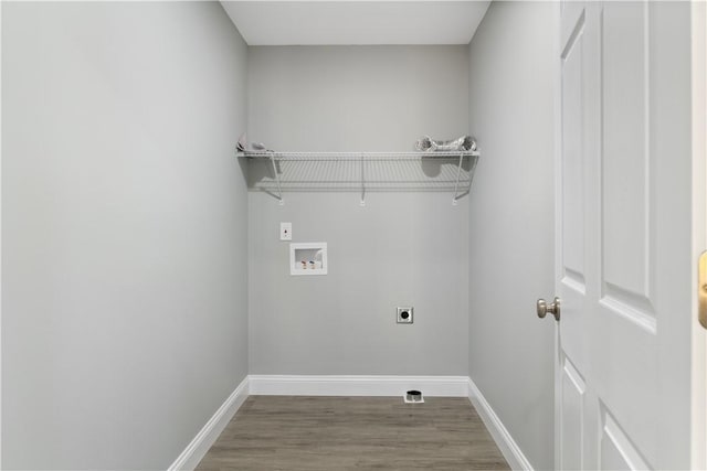 laundry room with washer hookup, hookup for an electric dryer, and hardwood / wood-style flooring