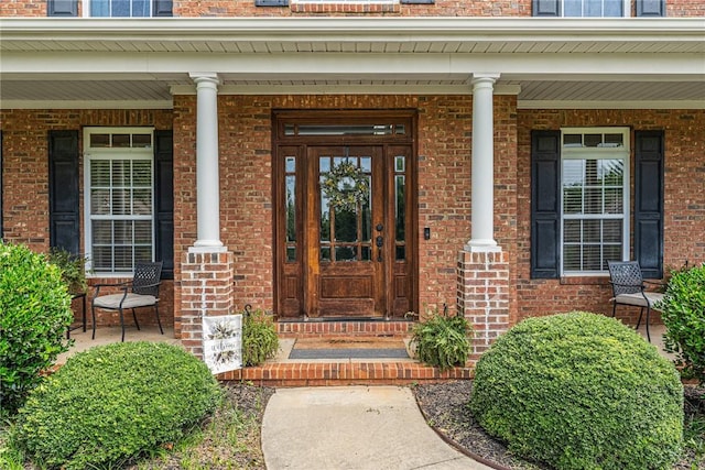 entrance to property featuring covered porch