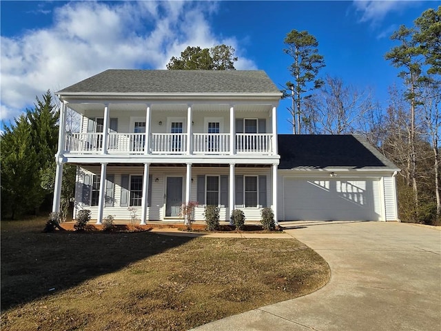 view of front of home featuring a porch and a garage