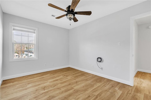 spare room with ceiling fan and light hardwood / wood-style floors