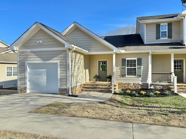 view of front of house with covered porch and a garage