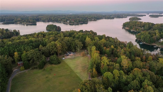 aerial view at dusk with a water view