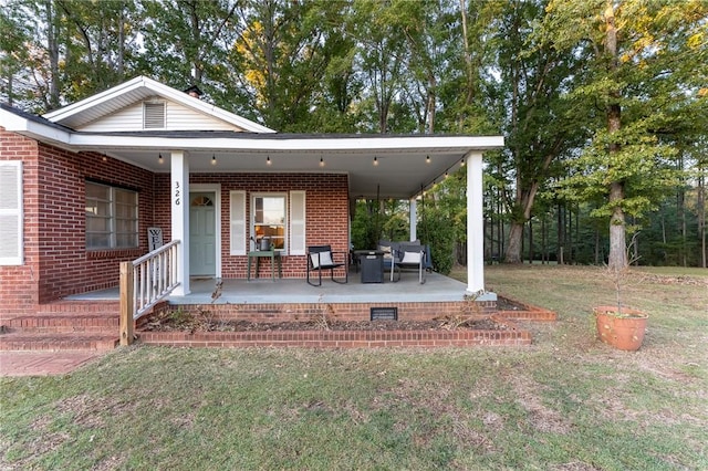 exterior space featuring a porch and a yard