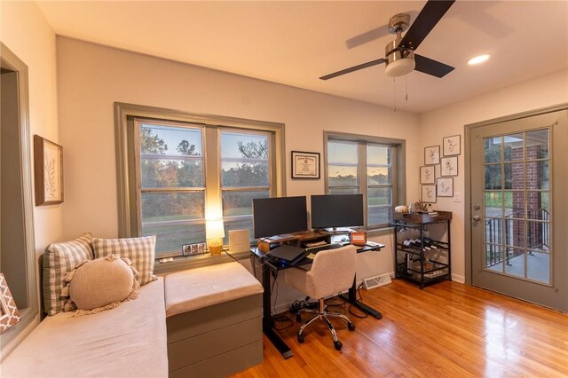 office area with ceiling fan and light wood-type flooring