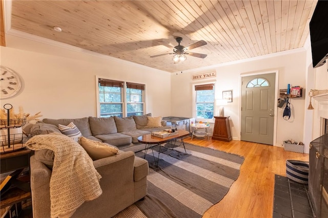 living room with wooden ceiling, light wood-type flooring, and crown molding