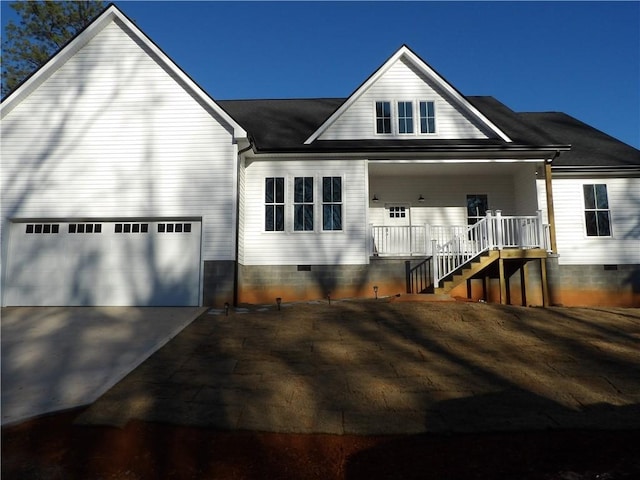 view of front facade featuring a garage and a porch