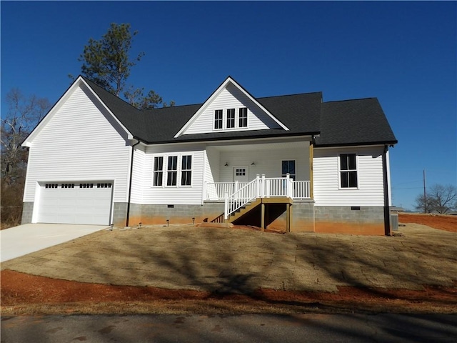 view of front facade with covered porch and a garage