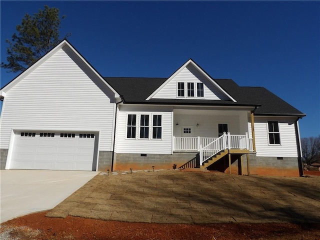 view of front of home with a porch and a garage