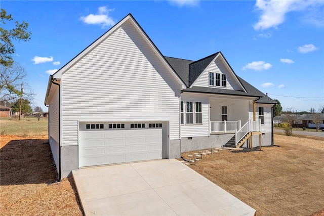 view of front of home with a porch, concrete driveway, an attached garage, and crawl space