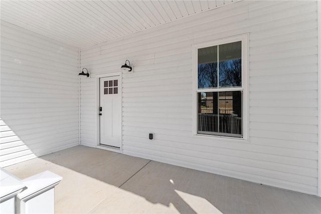 doorway to property with a patio area