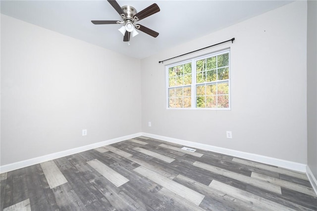 empty room with ceiling fan and wood-type flooring