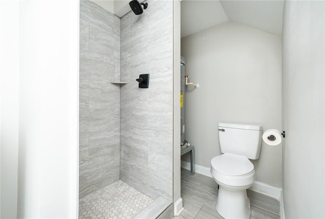 bathroom with toilet and tiled shower