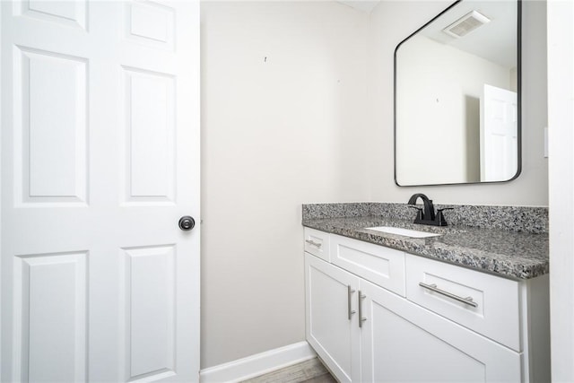 bathroom with wood-type flooring and vanity