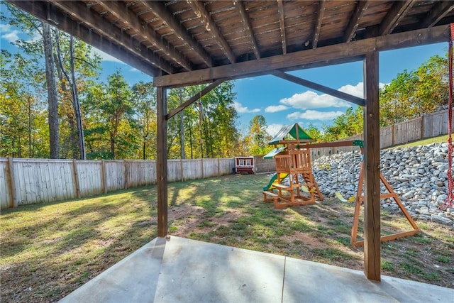 view of yard with a playground and a patio