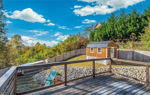 wooden terrace featuring a storage unit