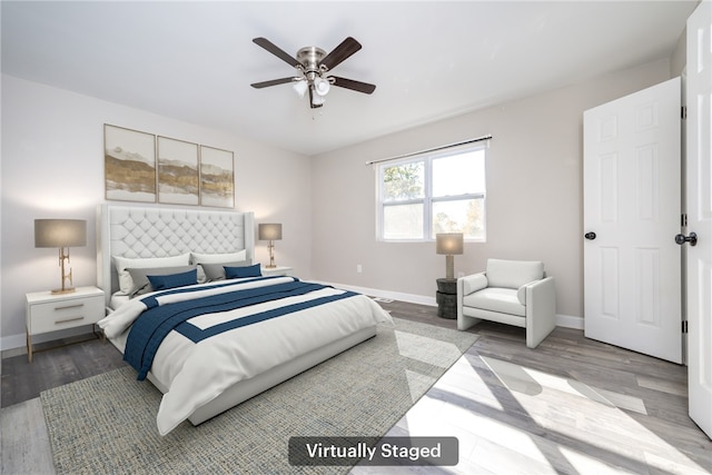 bedroom with light wood-type flooring and ceiling fan