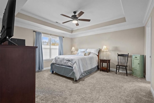 bedroom featuring ceiling fan, crown molding, light colored carpet, and a raised ceiling