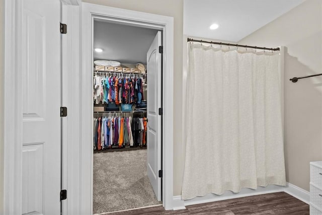 bathroom with shower / bath combo with shower curtain