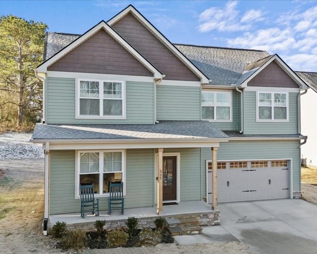 view of front of property with a garage and a porch