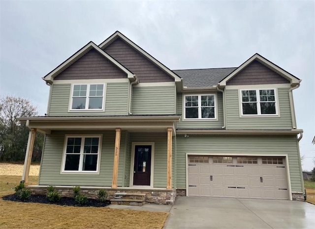 craftsman-style house with a garage and a porch