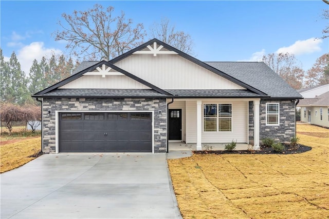 craftsman-style house with a front yard and a garage